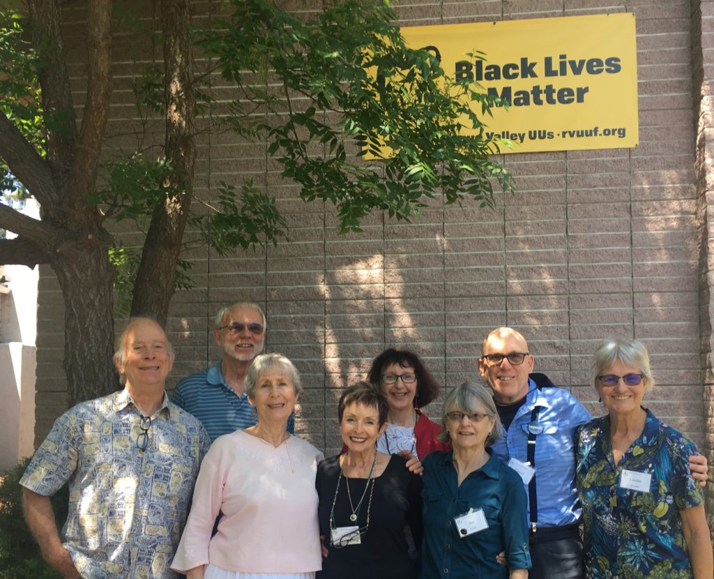 Members of Social Justice & Action with RVUUF's Black Lives Matter banner
