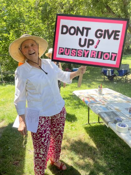 Suzanne & her protest sign that says, "Don't Give Up! Pussy Riot."